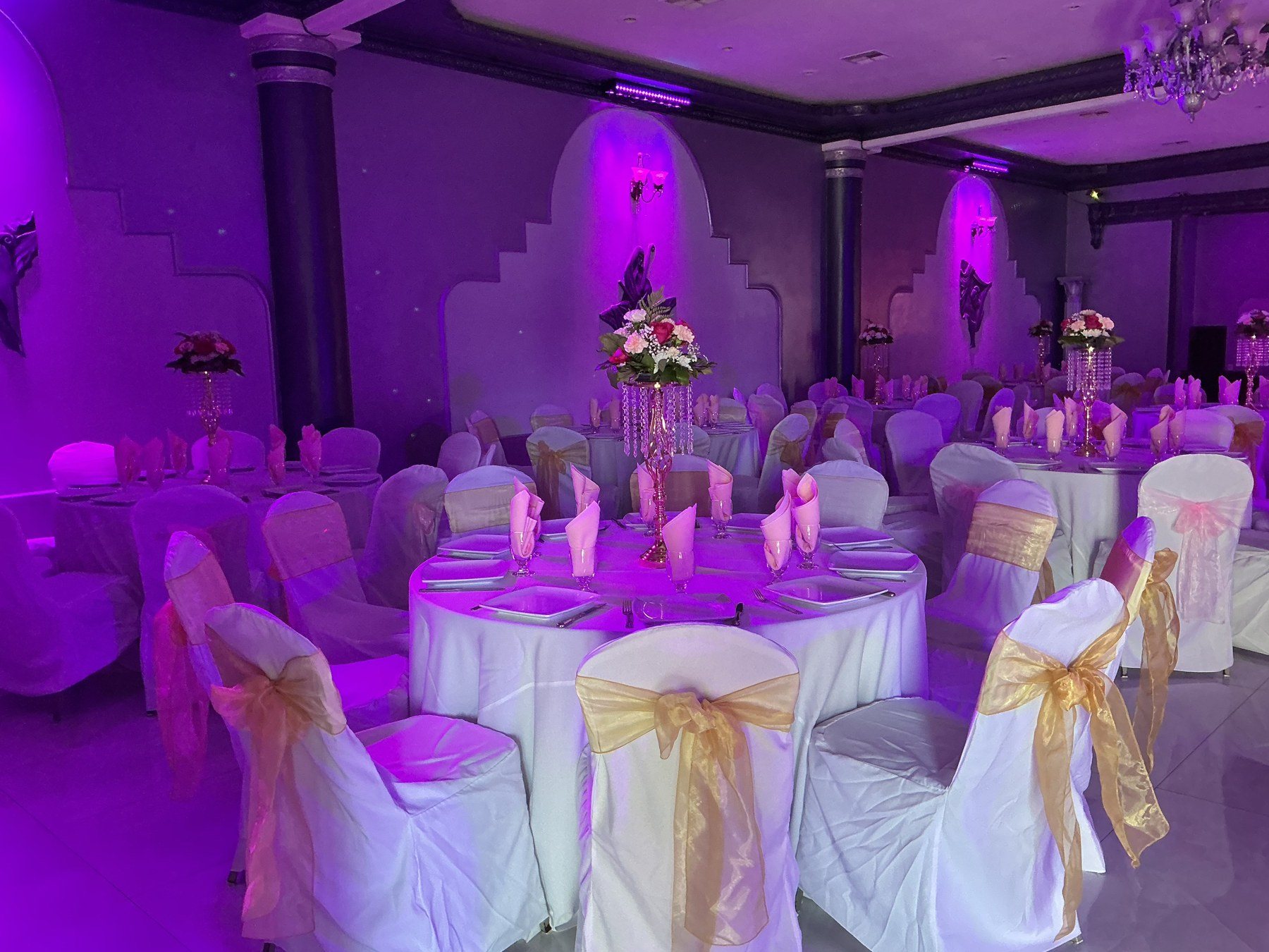 Tables under purple uplighting