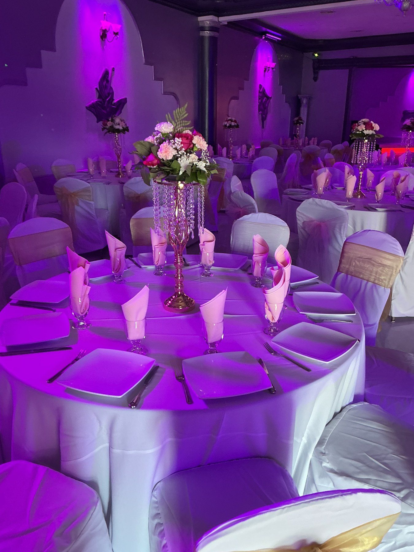 A centerpiece under purple light